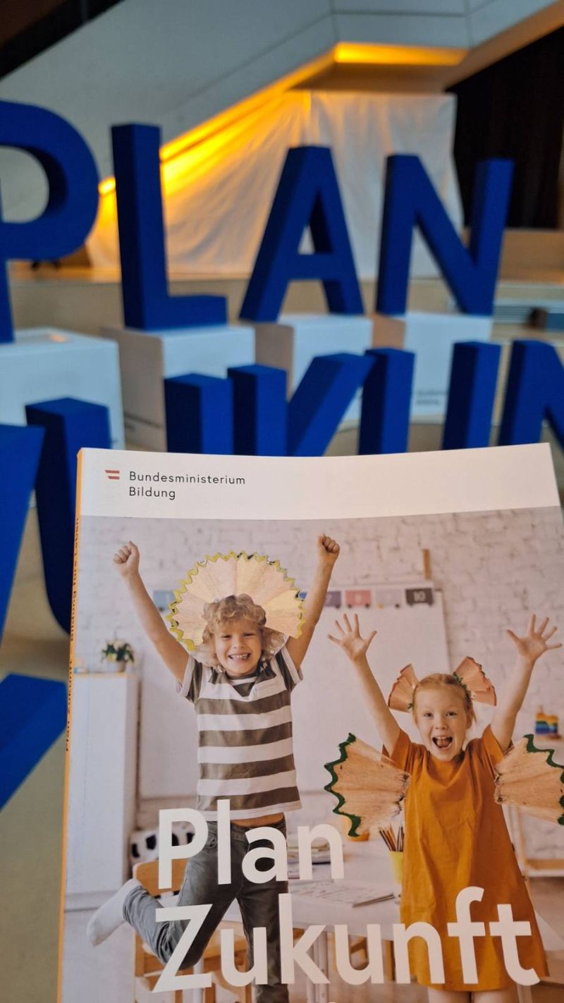 Plan Zukunft publication photographed in front of the programme’s dimensional lettering